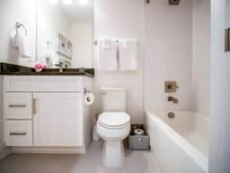 Experience comfort in this full bathroom with complete essentials. Whether you prefer a relaxing soak or a refreshing shower, the tub and shower combo has you covered. Enjoy the convenience of fresh towels, making every moment a rejuvenating escape!