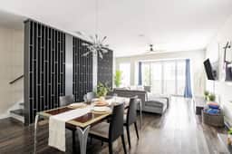 2nd Level - Experience an open layout that effortlessly links the living room, dining area, and kitchen. Enjoy the added convenience of a guest-friendly half bath. A flawless fusion of style and practicality awaits you.