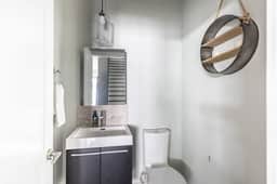 Effortless convenience meets tasteful charm. This half bath comes complete with essentials, offering a simple space for your comfort!