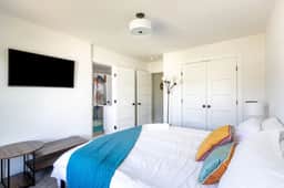 Indulge in Bedroom 3's luxury—a King bed, attached full bathroom, and unbeatable convenience. This bedroom and bedroom 4 share a bathroom (both have direct access from their bedroom).