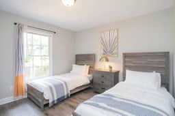 Unwind in Bedroom 3 with two Twin beds for a restful evening!