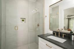 This full bathroom, accessible from Bedroom 3, is perfect for refreshing after a day of fun or relaxing in your own private space