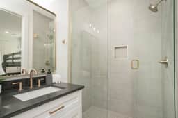 This full bathroom, connected to Bedroom 4, delivers hotel-quality comfort with its upscale features for a refined experience.