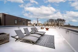 Cozy outdoor seating, fire pit, and a grill set the stage for unforgettable nights of BBQ and chill vibes!