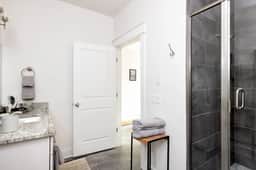 First-floor bathroom. Refresh under the soothing shower with towels provided for your convenience.
