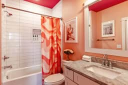 With a relaxing bathtub and easy access from Bedroom 3 and the hallway, this bathroom makes freshening up feel effortless.