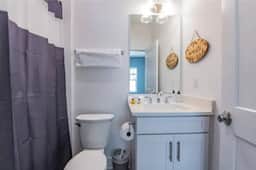 This clean full bath (with bathtub) is connected to bedroom 1 on the first floor