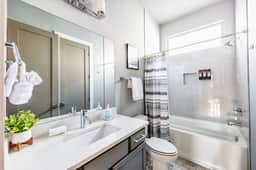 Elevate your stay with this full bathroom on the second floor, featuring a relaxing bathtub for your utmost comfort!