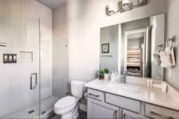 This full bathroom, attached to bedroom 4 on the fourth floor, offers a spacious shower. A perfect retreat after a day of exploring!