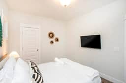 Your serene retreat is ready, featuring a queen bed, ambient lighting, and a smart TV for the perfect relaxation experience!