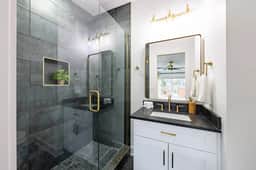 This full bathroom is conveniently connected to Bedroom 1. Designed with luxury in mind, featuring modern fixtures and premium toiletries!