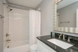Convenience meets sophistication in this 1st floor bathroom, seamlessly accessible from Bedroom 1.