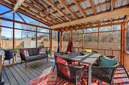 Gather with friends and family on this fully netted patio, bug-free summer nights, cozy hammock naps, and long dinners under the open sky await.