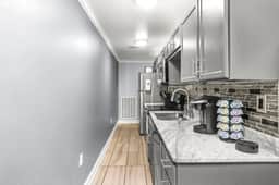 Sleek counters, stainless steel appliances, and everything you need to whip up your favorite meals away from home.
