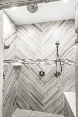 Step into the clean and spacious walk-in shower for a rejuvenating experience.