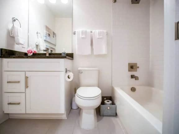 Experience comfort in this full bathroom with complete essentials. Whether you prefer a relaxing soak or a refreshing shower, the tub and shower combo has you covered. Enjoy the convenience of fresh towels, making every moment a rejuvenating escape!