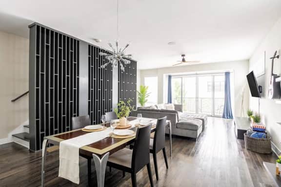 2nd Level - Experience an open layout that effortlessly links the living room, dining area, and kitchen. Enjoy the added convenience of a guest-friendly half bath. A flawless fusion of style and practicality awaits you.