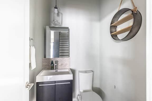 Effortless convenience meets tasteful charm. This half bath comes complete with essentials, offering a simple space for your comfort!