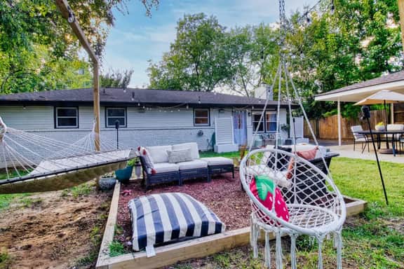 Unwind in the shared backyard, complete with comfortable furniture perfect for morning coffee or evening chats under the stars!
