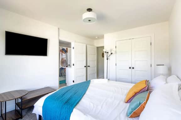 Indulge in Bedroom 3's luxury—a King bed, attached full bathroom, and unbeatable convenience. This bedroom and bedroom 4 share a bathroom (both have direct access from their bedroom).