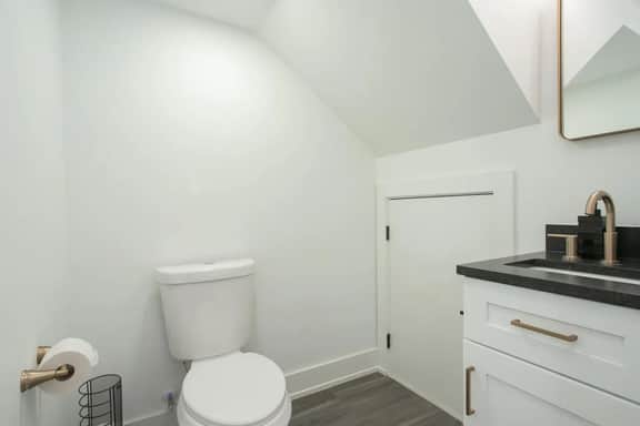 The half bathroom on the first floor offers easy access from the living, dining, and kitchen areas. A practical addition that ensures convenience for all your guests!