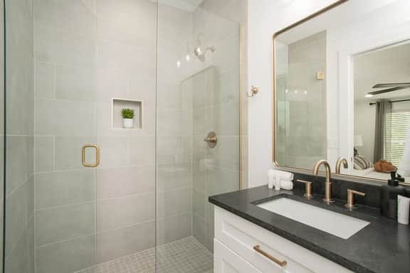 This full bathroom, accessible from Bedroom 3, is perfect for refreshing after a day of fun or relaxing in your own private space