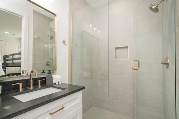 This full bathroom, connected to Bedroom 4, delivers hotel-quality comfort with its upscale features for a refined experience.