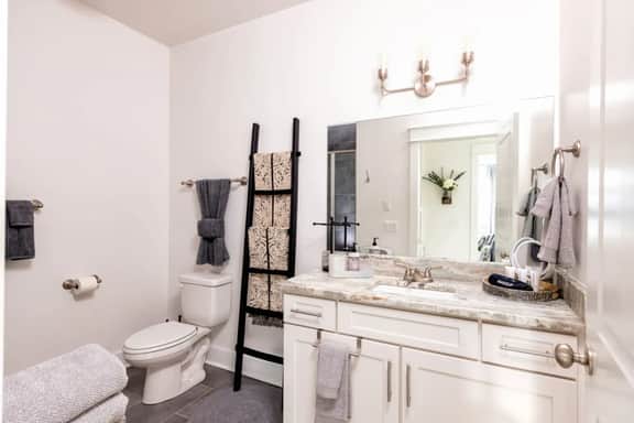 Indulge in the elegance of our first-floor full bathroom. Enjoy a refreshing shower in style with a breezy ambiance!