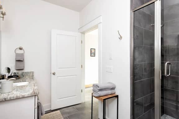 First-floor bathroom. Refresh under the soothing shower with towels provided for your convenience.