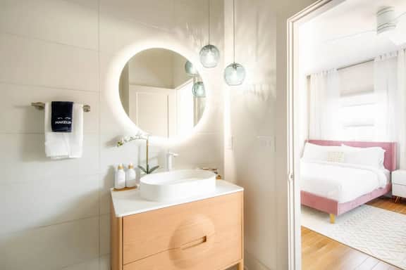 Unit 1 - Full bathroom connected to bedroom with two Queen beds