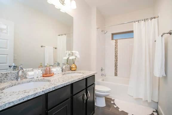 Whether you love a quick rinse or a long soak, this full bathroom on the second floor has you covered with a shower and tub combo. Towels and all the must-have toiletries are provided—just bring your bubble bath!