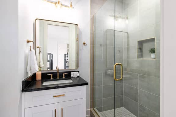 This full bathroom is connected to Bedroom 4. Experience a hotel-like comfort with elegant touches!