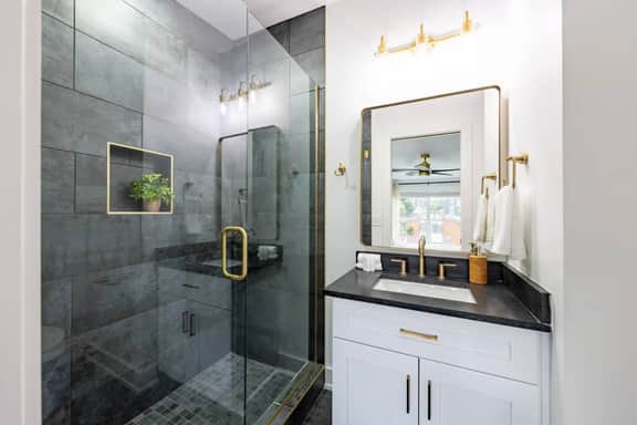 This full bathroom is conveniently connected to Bedroom 1. Designed with luxury in mind, featuring modern fixtures and premium toiletries!