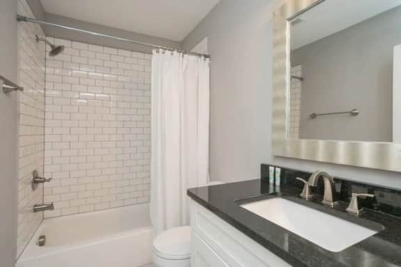 Convenience meets sophistication in this 1st floor bathroom, seamlessly accessible from Bedroom 1.