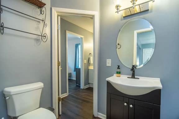 Toilet + sink connects directly to master bathroom, also connects to livingroom.