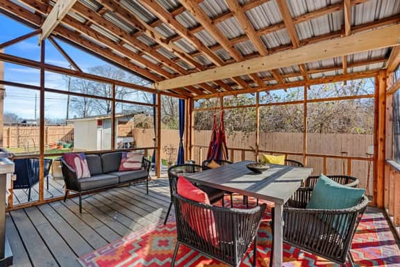 Gather with friends and family on this fully netted patio, bug-free summer nights, cozy hammock naps, and long dinners under the open sky await.