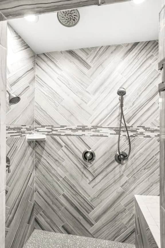 Step into the clean and spacious walk-in shower for a rejuvenating experience.