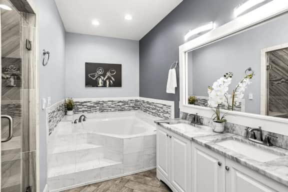 Pamper yourself in Bathroom 2, where luxury meets sophistication. A full bath with his and hers sinks, a lavish bathtub, and a touch of class. Your private spa retreat awaits!