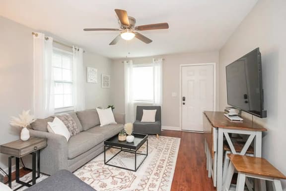 Unwind in style! Our well-designed living room offers a comfortable sofa, perfect for relaxing after a day of exploration. Your cozy retreat awaits!