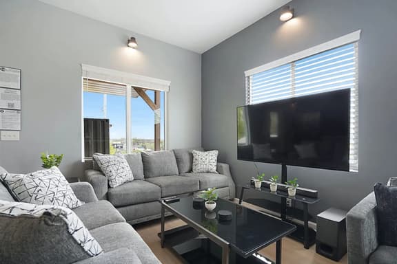 Experience the perfect blend of cozy and vibrant in the living room. Sink into a comfy couch amid a bright, lively ambiance!