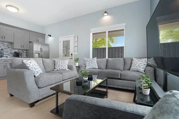 Experience the perfect blend of cozy and vibrant in Unit A's living room. Sink into a comfy couch amid a bright, lively ambiance!