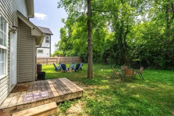 Almost .25 acre backyard with fire pit, now fully fenced in!