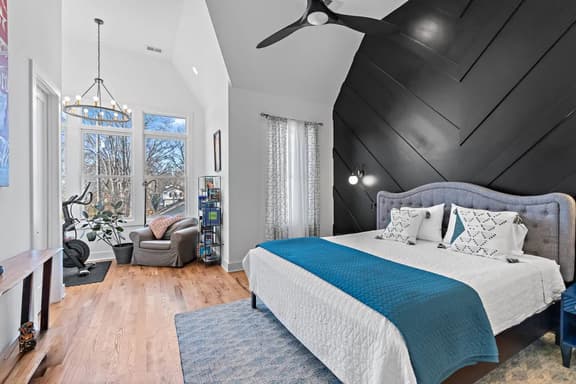 A boutique-hotel inspired suite with chic details and a private bath, designed for slow mornings and restful nights.